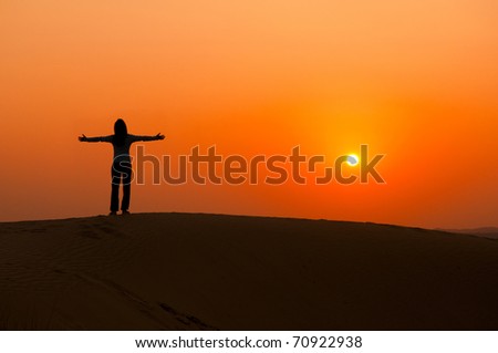 silhouette of a freedom girl on thar sam sand dune desert