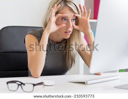 Tired woman in front of computer
