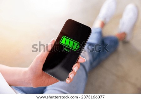 Similar – Image, Stock Photo woman charging batteries in the middle of nature