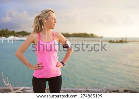 Fitness model standing outdoors in early morning