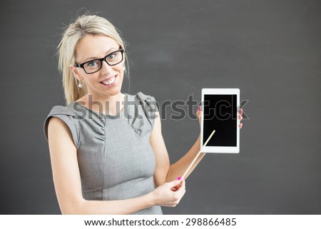 Teacher showing tablet computer