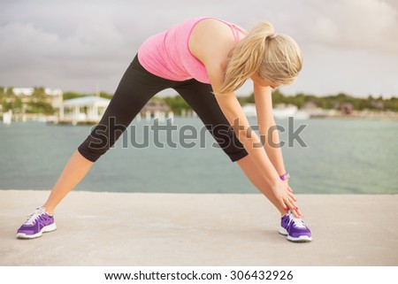 Woman stretching before morning exercise
