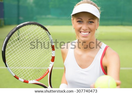 Cheerful tennis player on the court