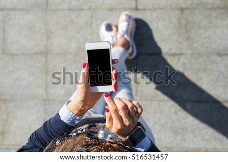 Similar – Image, Stock Photo Woman texting on smartphone while walking on sidewalk