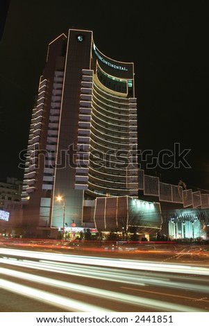 Intercontinental hotel from Bucharest at the night-time with light traces from cars