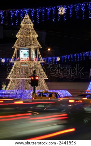 Night scene with Christmas tree in a big crossroad from Bucharest, Romania