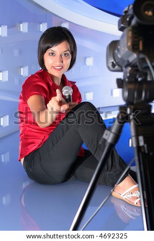 TV reporter with microphone showing the finger