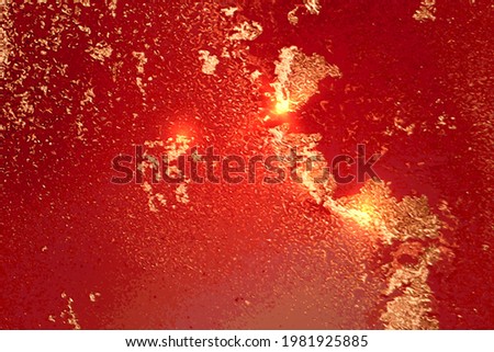 Scarlet red and gold abstract alcohol ink marble texture. Vector shining background with glitter. Template for banner, poster design. Fluid art painting