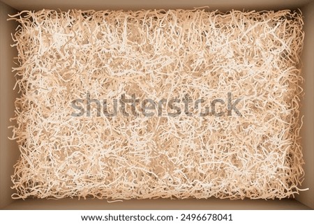 Top view of gift box with beige filler. Cardboard package filled with craft wrapping shredded paper for careful delivery of goods and fragile valuable presents. Vector illustration