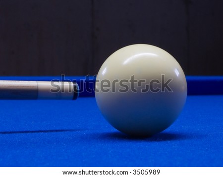 Pool table with cue ball and pool stick