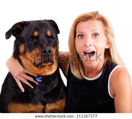 Self portrait of a blonde woman with an excited expression and her dog who is not so excited.