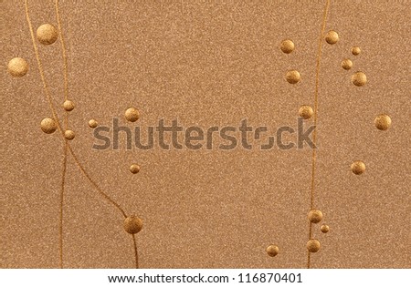 Gold foil dots and lines over golden textured background.