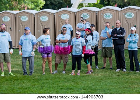 COEUR D ALENE, ID - JUNE 23:  Support staff in fun clothing waiting to help participants at the June 23, 2013 Ironman Triathlon in Coeur d\'Alene, Idaho.
