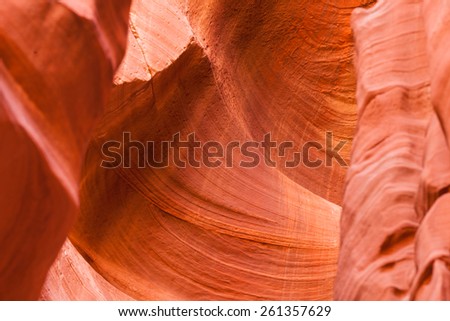 Eroded sandstone walls showing delicate swirls inside of Canyon X  which is near Antelope Canyon in Page, AZ.