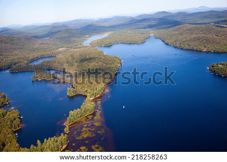 Adirondack forests and lakes summer aerial view from light aircraft cabin