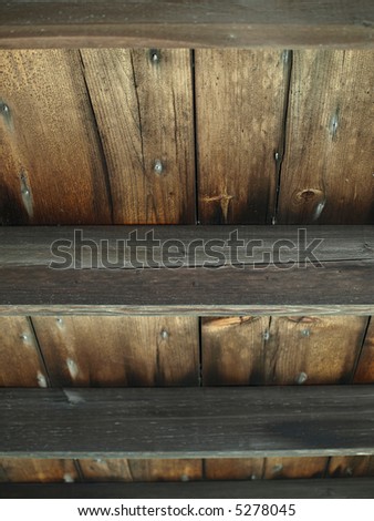 An old wooden slat ceiling with exposed beams