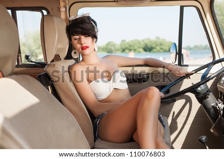 Very beautiful woman relaxing in car near the beach - outdoors