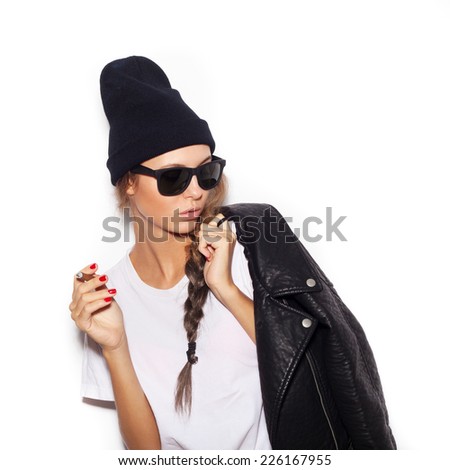 Hipster girl in sunglasses and black leather jacket smoking cigarette.  White background, not isolated