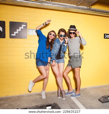 Two young girls and guy having fun. Lifestyle