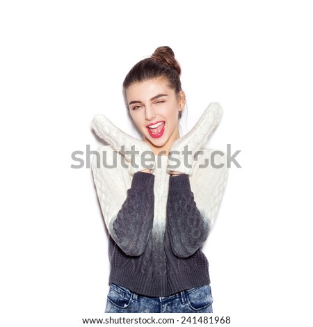 Happy young woman experiencing the joy raising her hands up. Beautiful Girl opening Mouth. Emotion.  Hairstyle. Make-up.  White background, not isolated