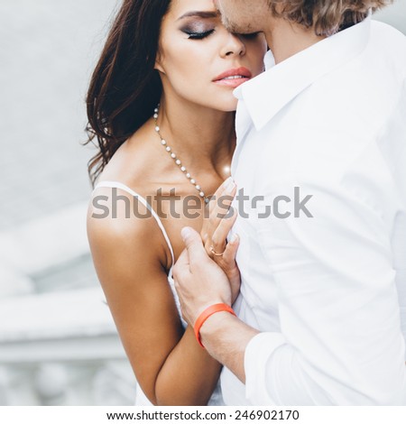Young couple loving each other. Man kissing a woman.