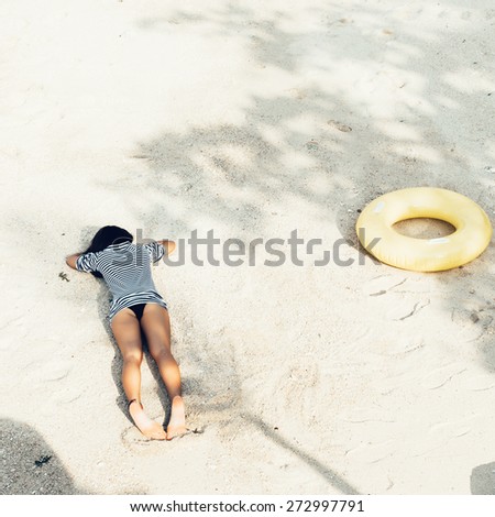 attractive woman in bikini, outdoor shot in sand, summer day