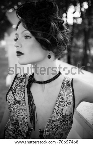 Retro Woman Portrait. Beautiful Woman. Vintage Styled Photo. Old Fashioned Makeup and Finger Wave Hairstyle. 20th or 30th style