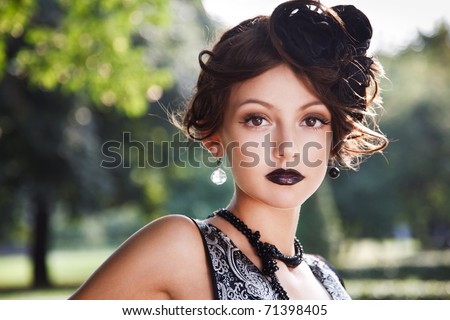 Retro Woman Portrait. Beautiful Woman. Vintage Styled Photo. Old Fashioned Makeup and Finger Wave Hairstyle. 20`s or 30`s style