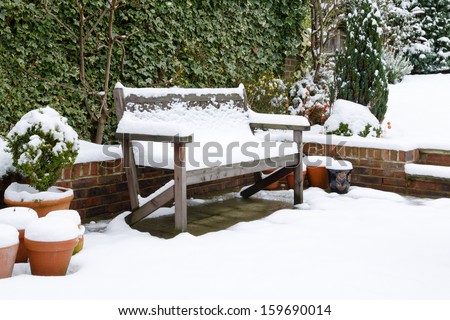 Garden patio bench with snow
