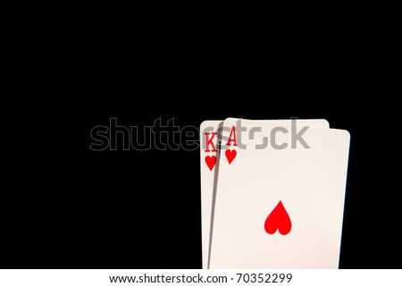 This is a shot of an Ace of Hearts and a King of Hearts shot on an isolated black background.