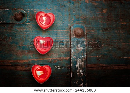 valentines candle on wooden background