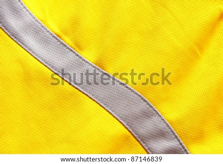 Close up of yellow polyester nylon yellow sportswear shorts to created a textured background.
