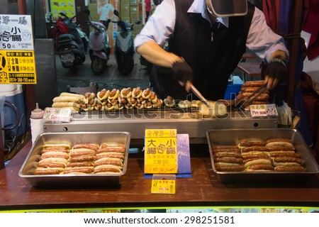 Kaohsiung, Taiwan - April 20,2015 : Chief cooking food to be sold in Liuhe Night Market in Kaohsiung, Taiwan