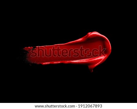Red lipstick smear isolated on black background Foto d'archivio © 