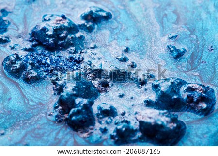 Blue nail polish texture with crushed eye shadow