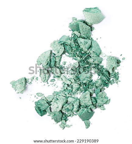 Crushed green eye shadow isolated on white background