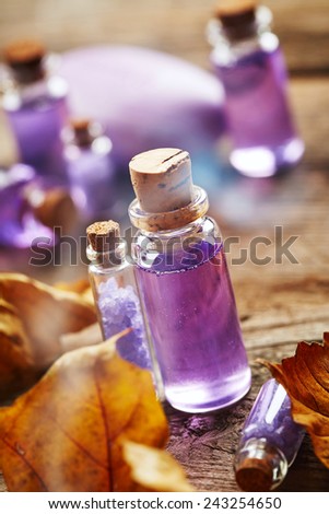 Purple Spa still life with autumn leaves on wooden background