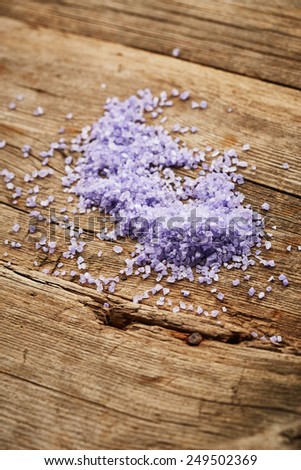 Purple sea salt on wooden background