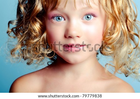 Funny little girl with blue eyes