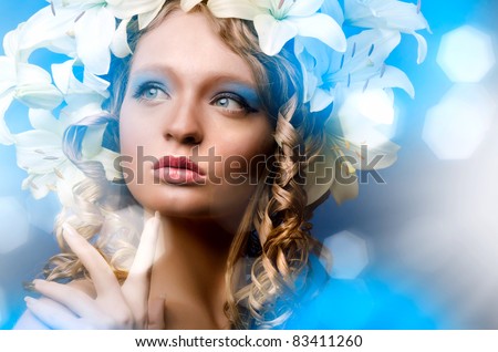 Portrait of young lady with lily flowers