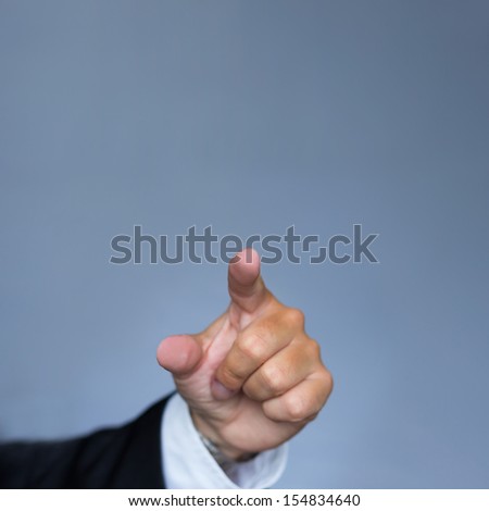 Hand in suit pointing