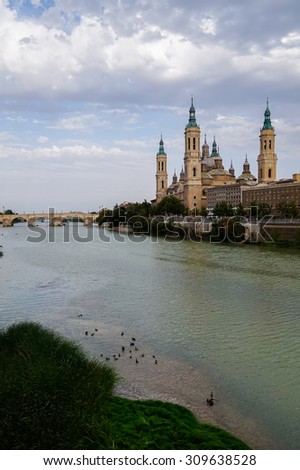 In the picture we can see the Cathedral del Pilar in Zaragoza , the river passes by her and the background we have a bridge