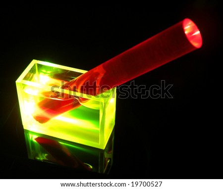 ruby rod in a dye solution exposed to laser beam