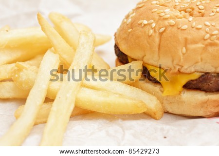 Fast food meal with cheeseburger and fries