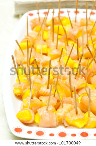 cold buffet with mango and salmon