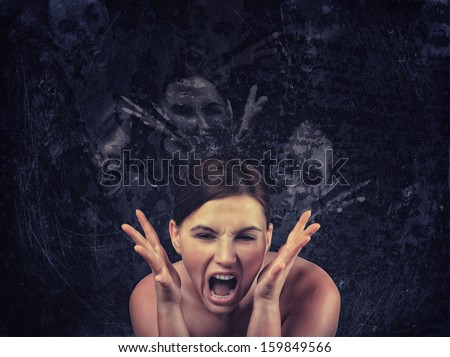 Screaming woman over dark background