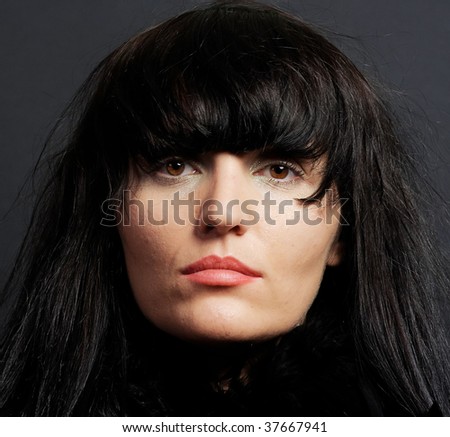 Beautiful clean cosmetics woman close up portrait over black