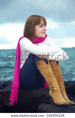 girl looking at sea. evening time