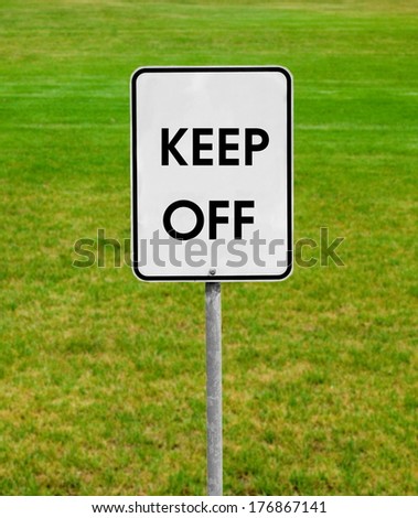keep off sign on the green lawn