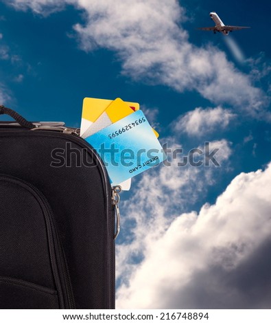 travel bag with credit cards on sky,travel concept